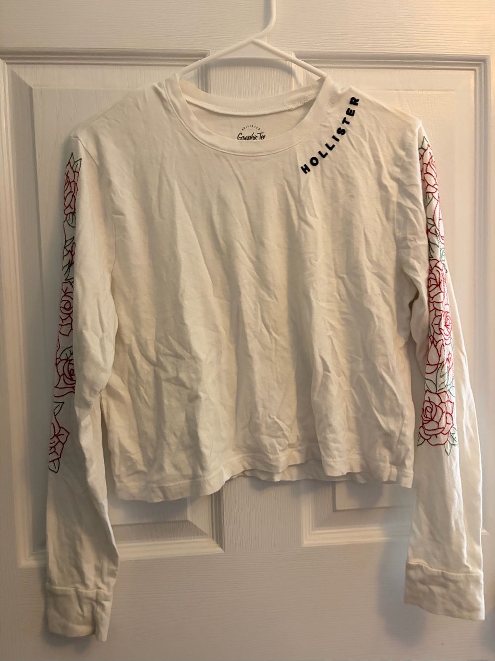 Hollister White Long-Sleeve Crop Tee with Red Rose Sleeve Detail